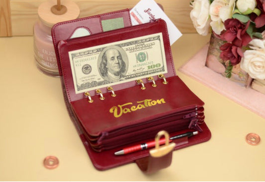 Personalized budget planner cover with name embossed and cash envelopes attached